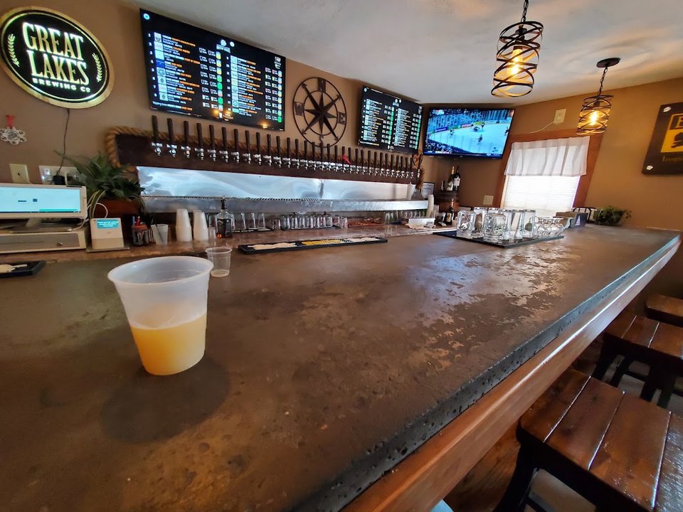 Bar area with taps behind the counter.
